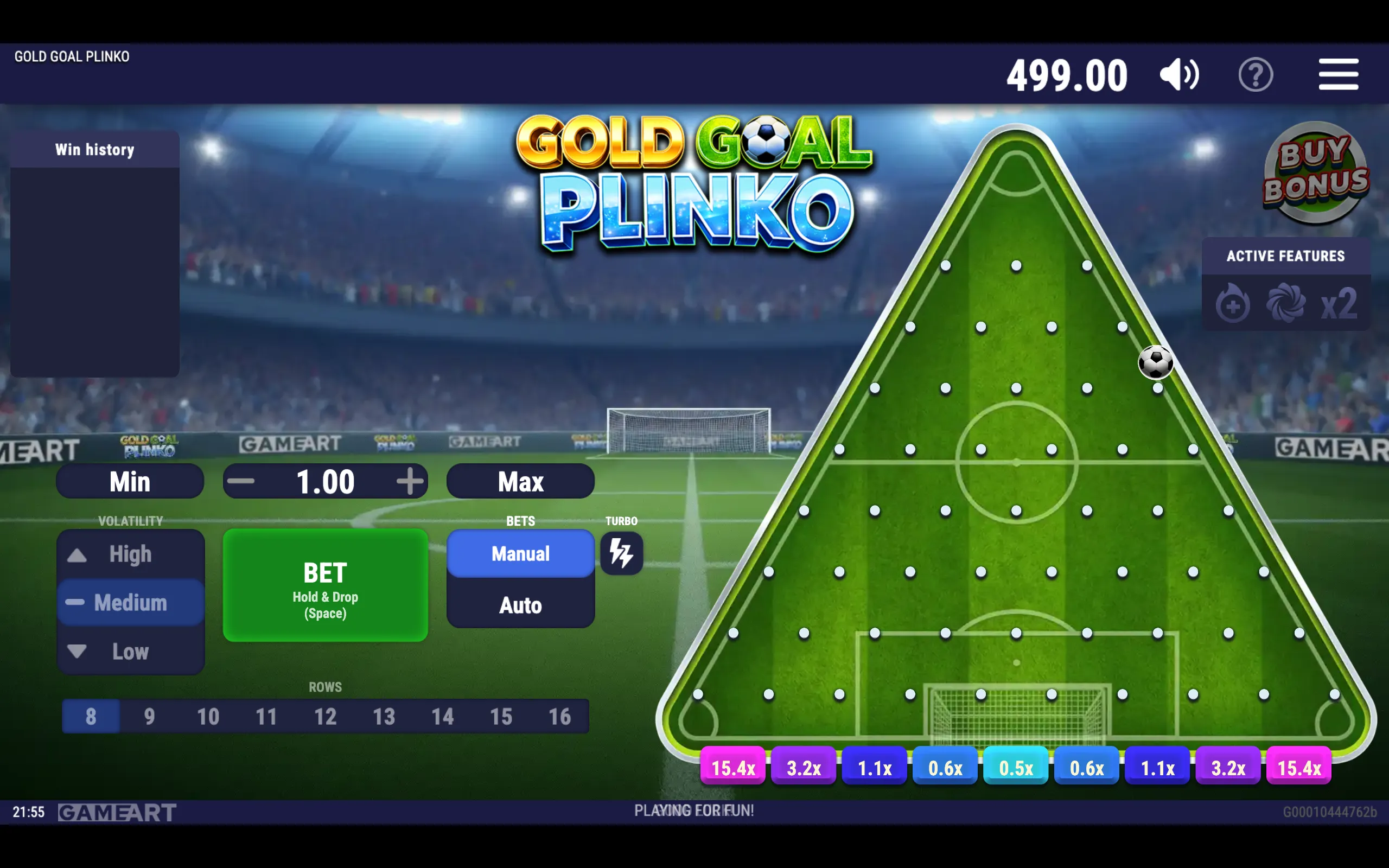 Gold Goal Plinko game interface featuring a football rolling through a triangular Plinko board on a floodlit soccer pitch, with colorful multiplier slots along the bottom.