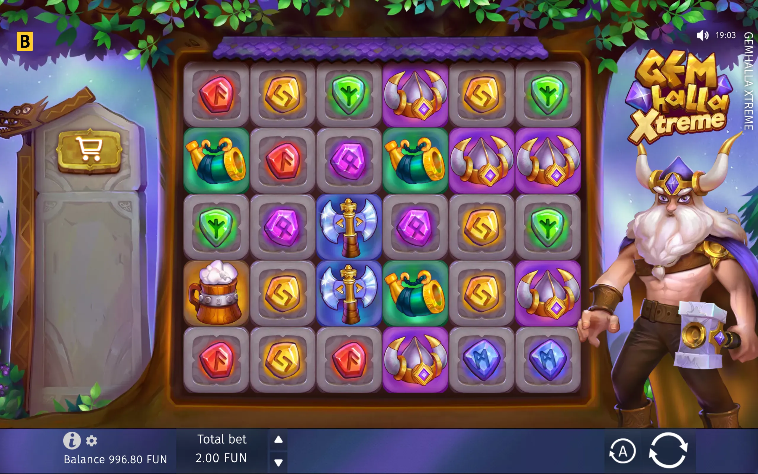 Gemhalla Xtreme slot interface with colorful rune gems, axes, drinking horns, helmets, and a muscular horned Viking warrior beneath a leafy fantasy backdrop.