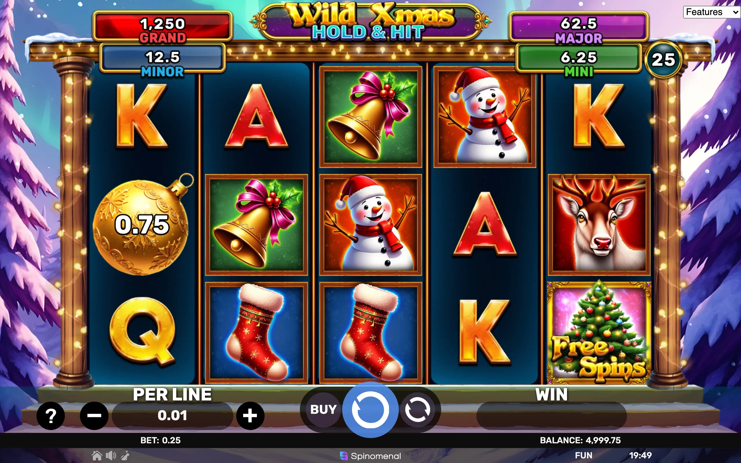 Christmas-themed slot game interface featuring symbols like snowmen, bells, stockings, reindeer, and a decorated Christmas tree with jackpot tiers displayed.
