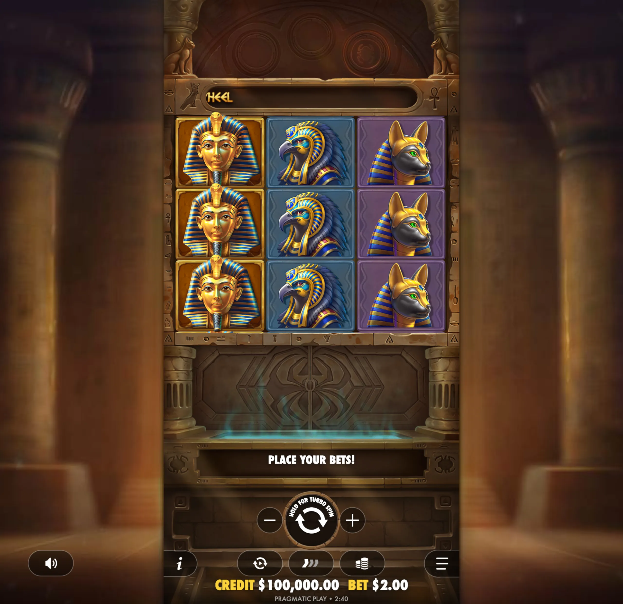 Slot game interface featuring Egyptian-themed symbols including a pharaoh, falcon, and jackal heads on a stone backdrop with hieroglyphics and pillars.