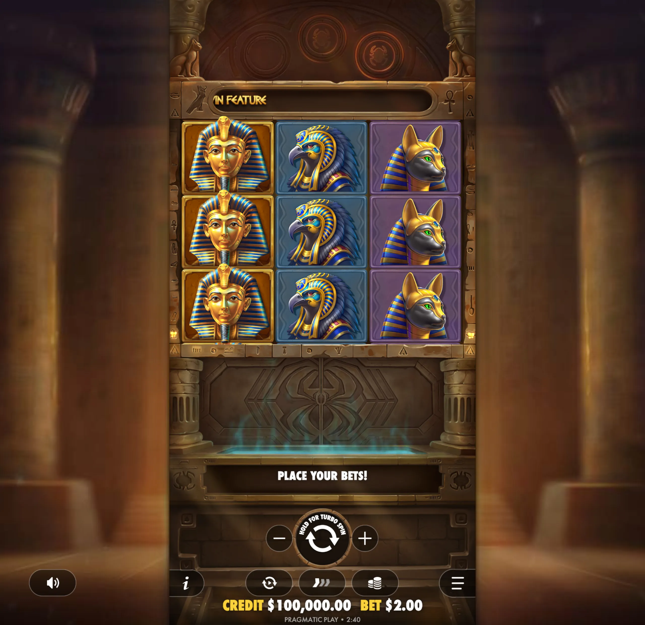 Slot game interface featuring Egyptian-themed symbols including a golden pharaoh, a falcon-headed god, and a jackal-headed god, set against a backdrop of ancient temple pillars and hieroglyphics.