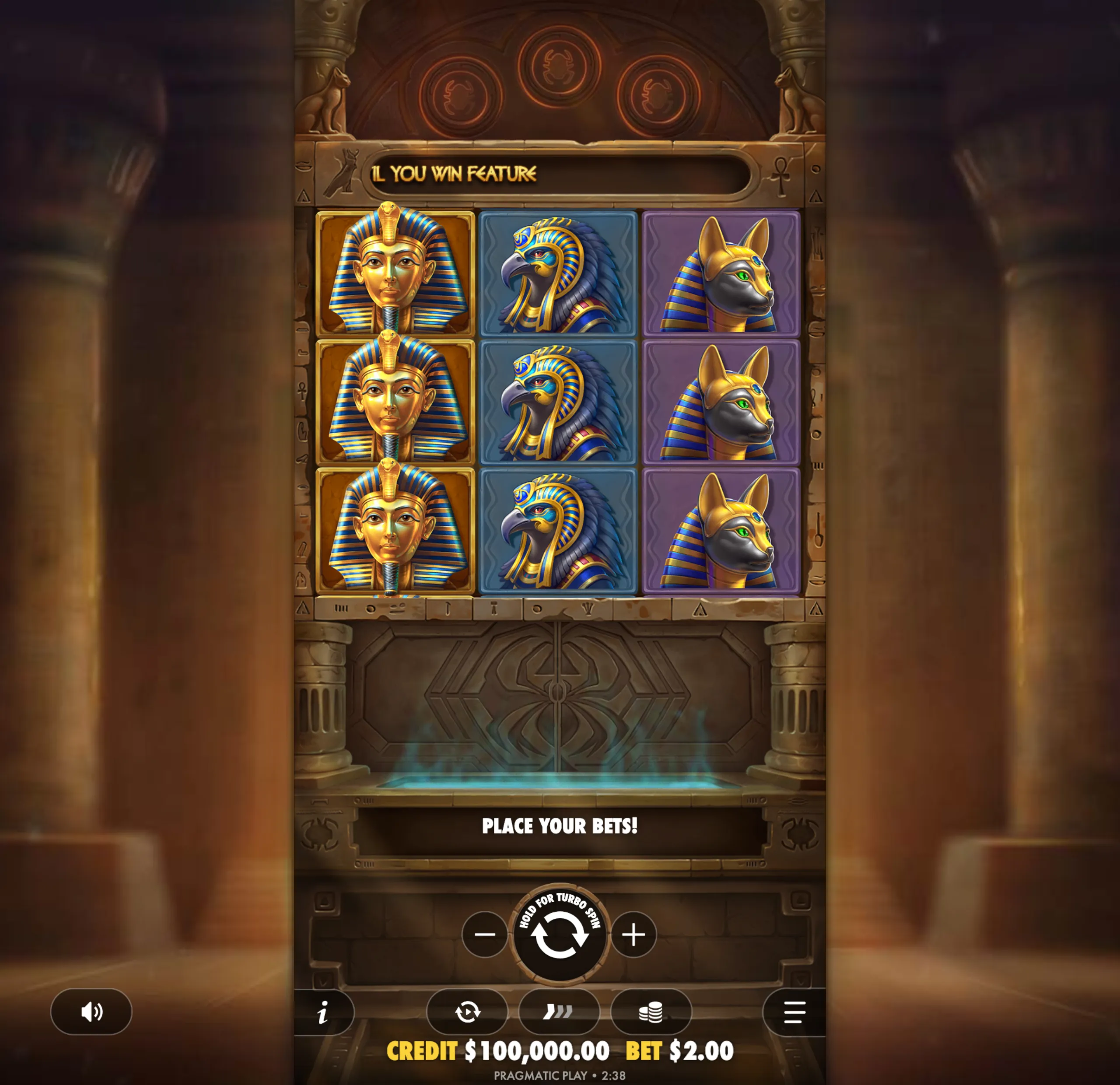Ancient Egyptian themed slot game interface featuring symbols of a pharaoh, falcon, and jackal in a stone temple setting.