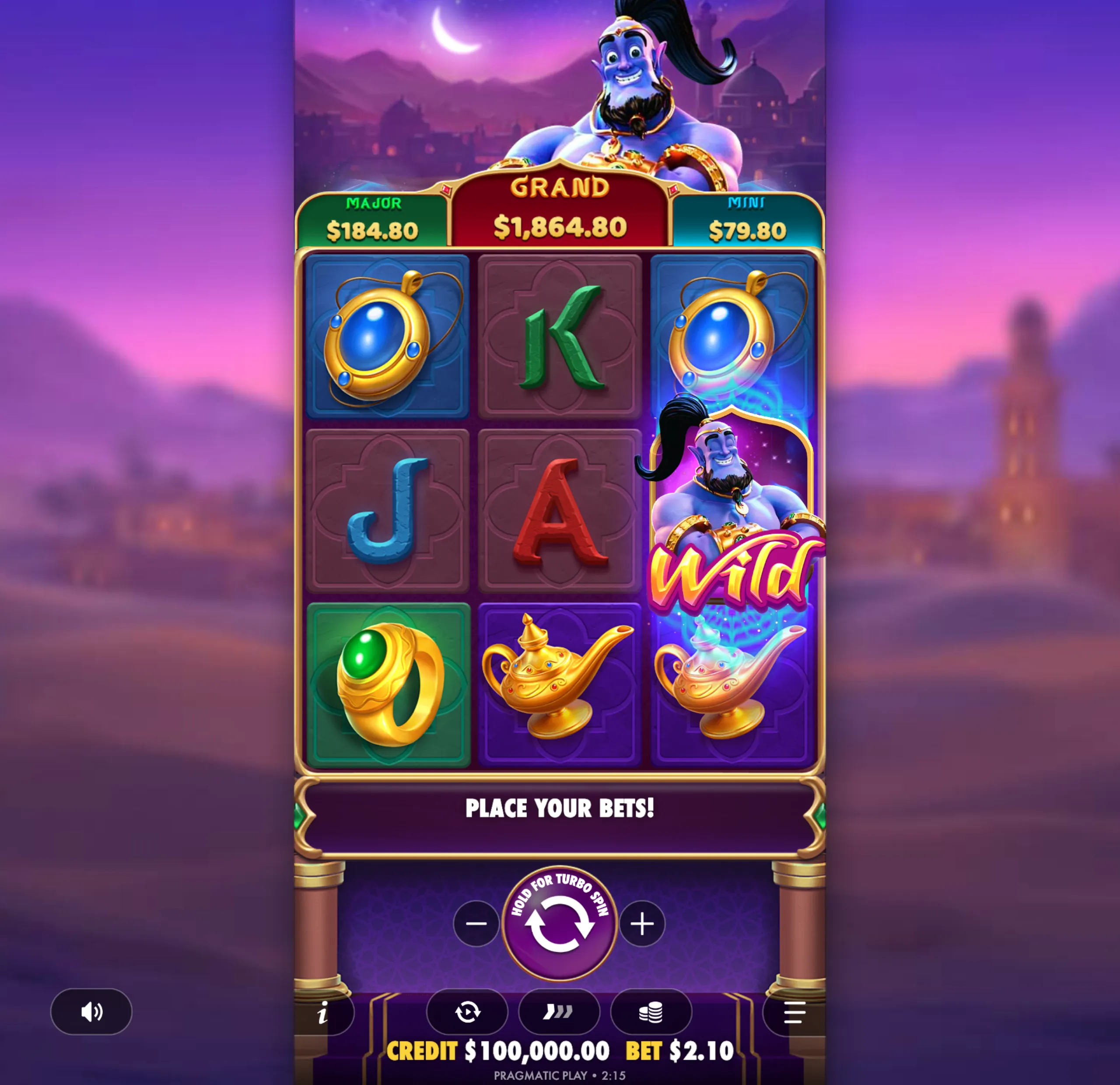 A slot game interface featuring a smiling blue genie, magical lamps, rings, and jewel symbols with jackpot tiers displayed above the reels against a twilight cityscape backdrop.