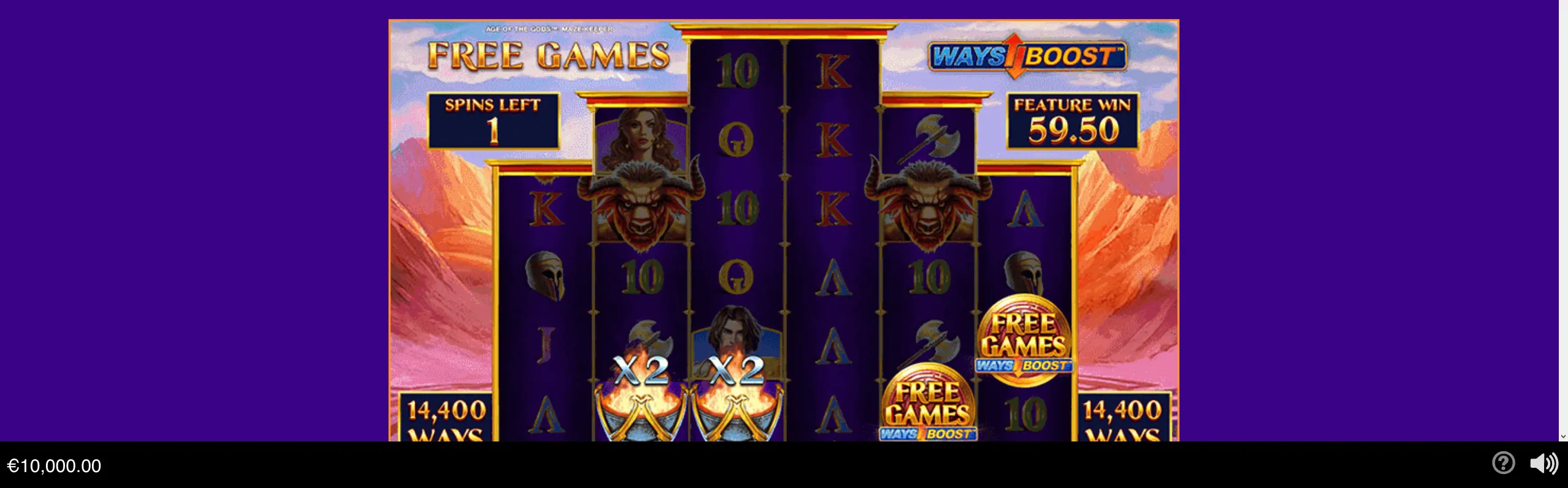 Greek mythology-inspired slot reels display a free-games bonus round with warrior characters, minotaur symbols, x2 multipliers, and a mountainous fantasy backdrop.