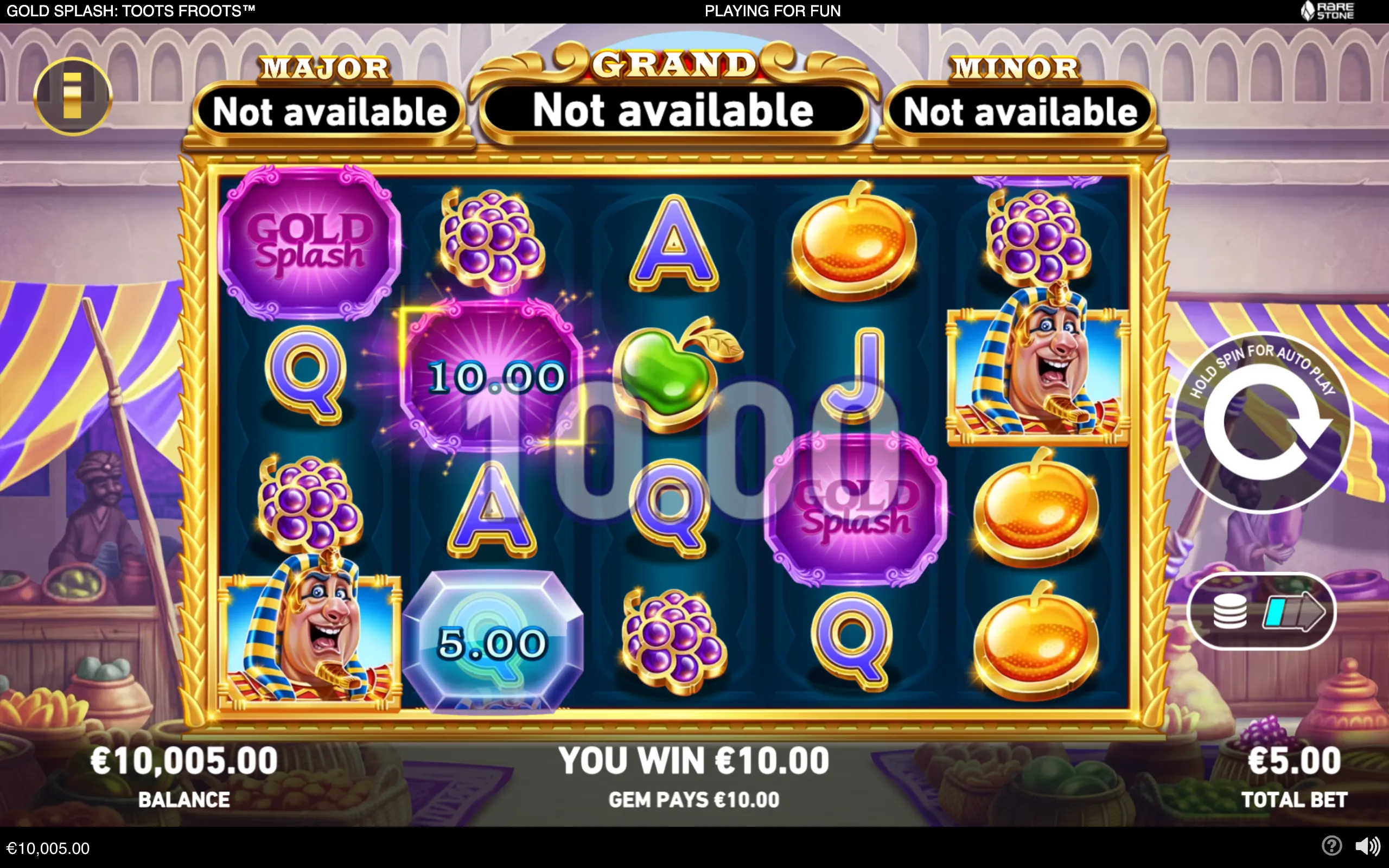 Egyptian-themed Gold Splash slot interface with purple gem symbols, fruit, card letters, golden scarabs, a smiling pharaoh character, and a €10.00 win.