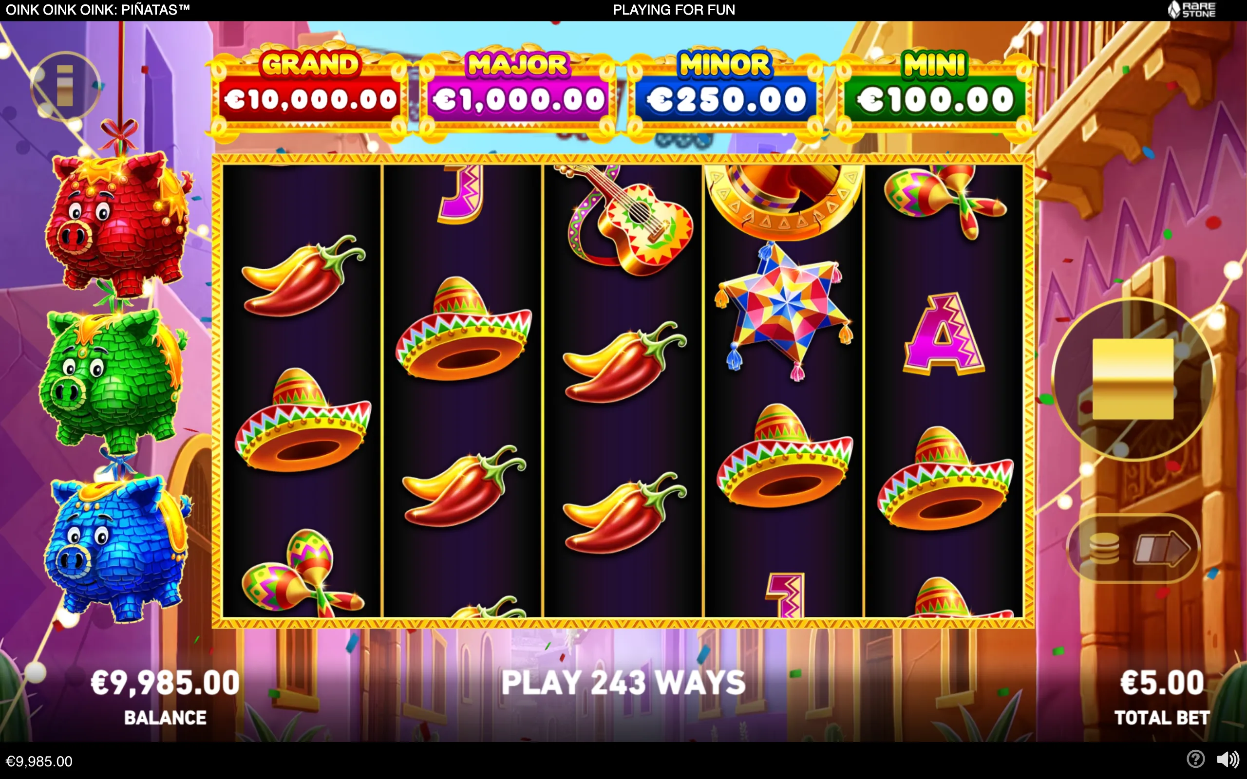 Oink Oink Oink: Piñatas slot with colorful pig-shaped piñatas, sombreros, maracas, guitars and chili peppers across five reels, set in a festive street scene with Grand, Major, Minor and Mini jackpot panels.