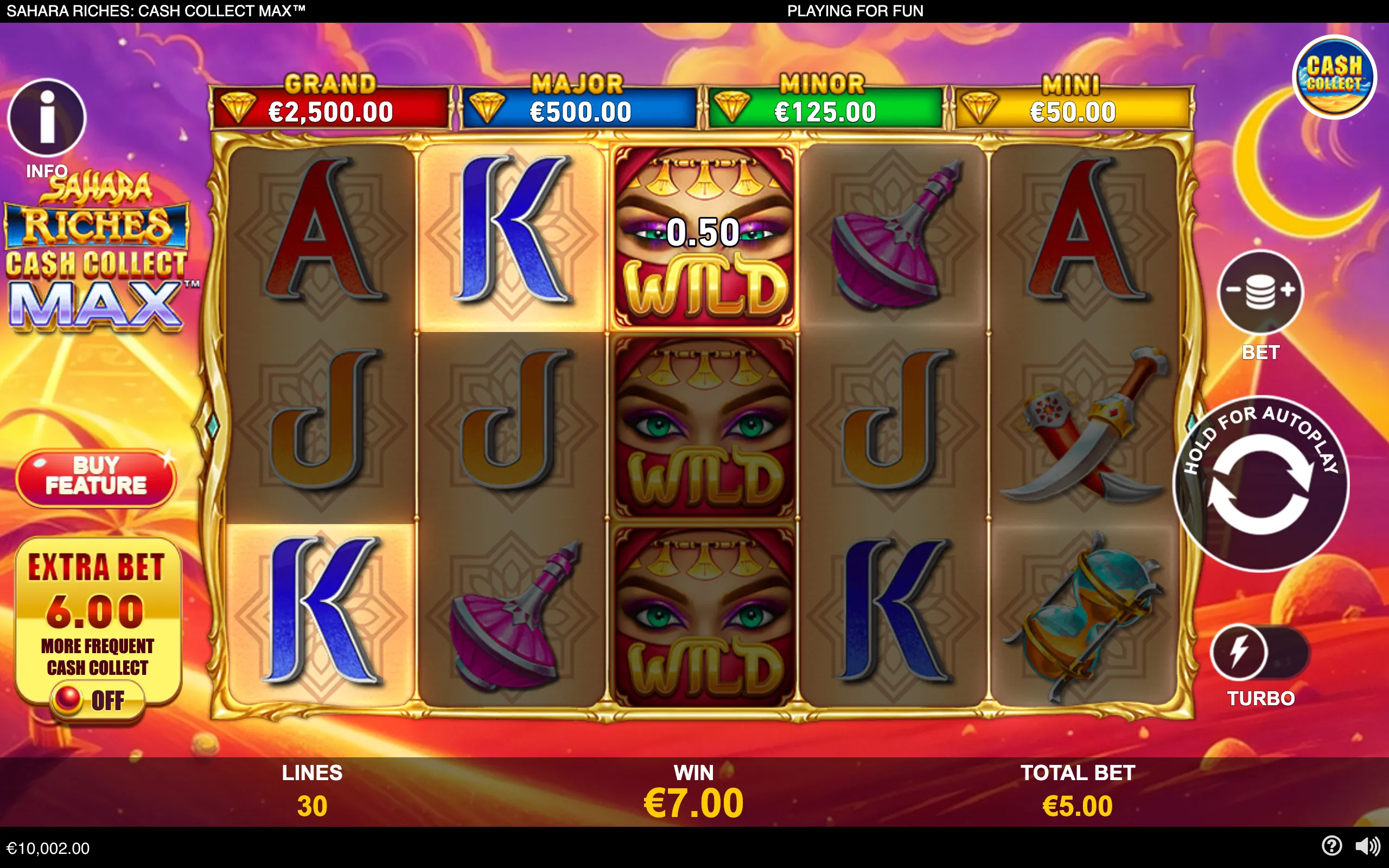 Sahara-themed slot interface with gold-framed reels, stacked masked-woman wild symbols, desert weapons, card symbols, jackpot tiers, and a displayed €7.00 win against a purple night-sky backdrop.