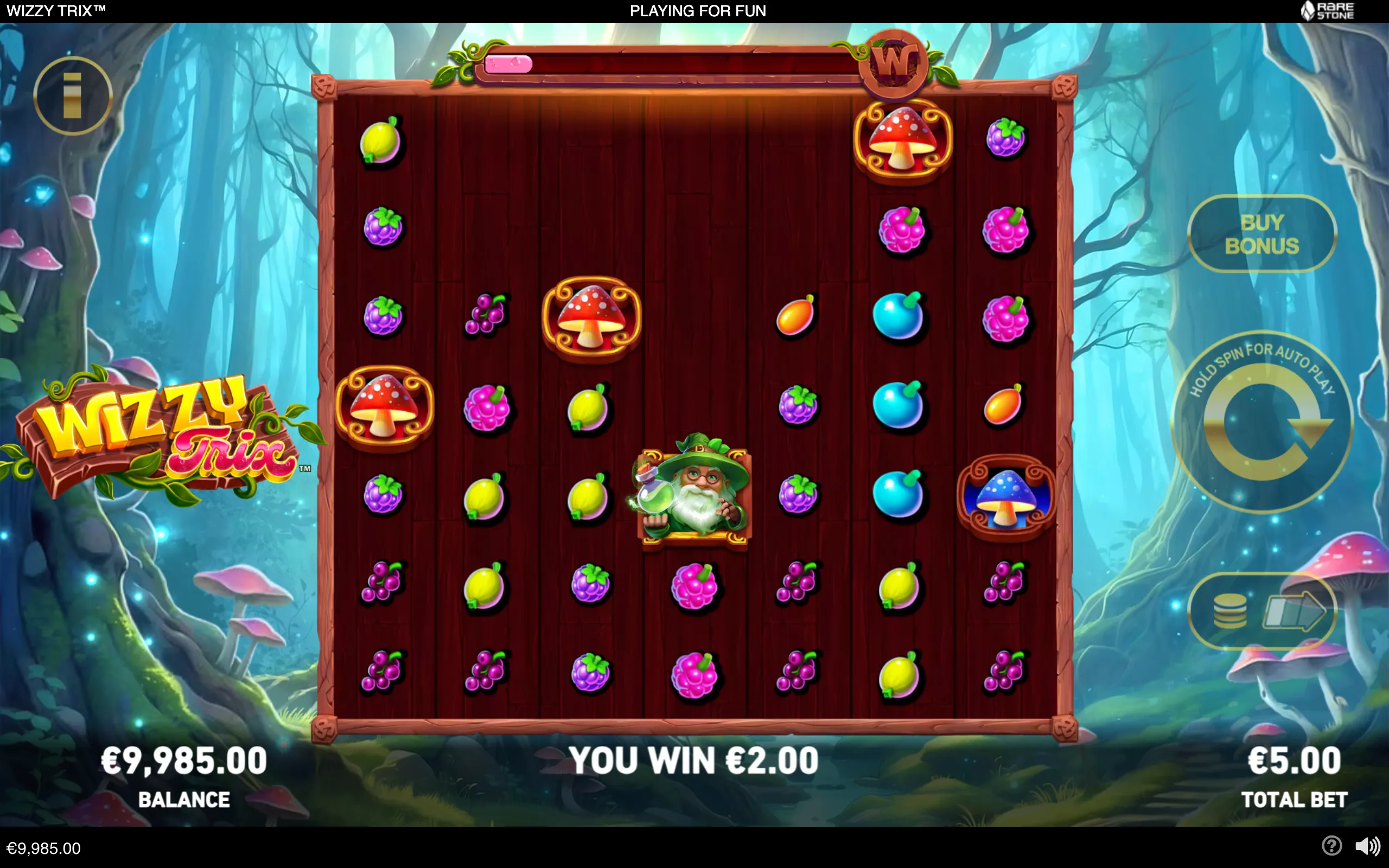Wizzy Trix slot reels filled with colorful berries, fruits, spotted mushrooms, and a bearded wizard, set inside an enchanted glowing forest.