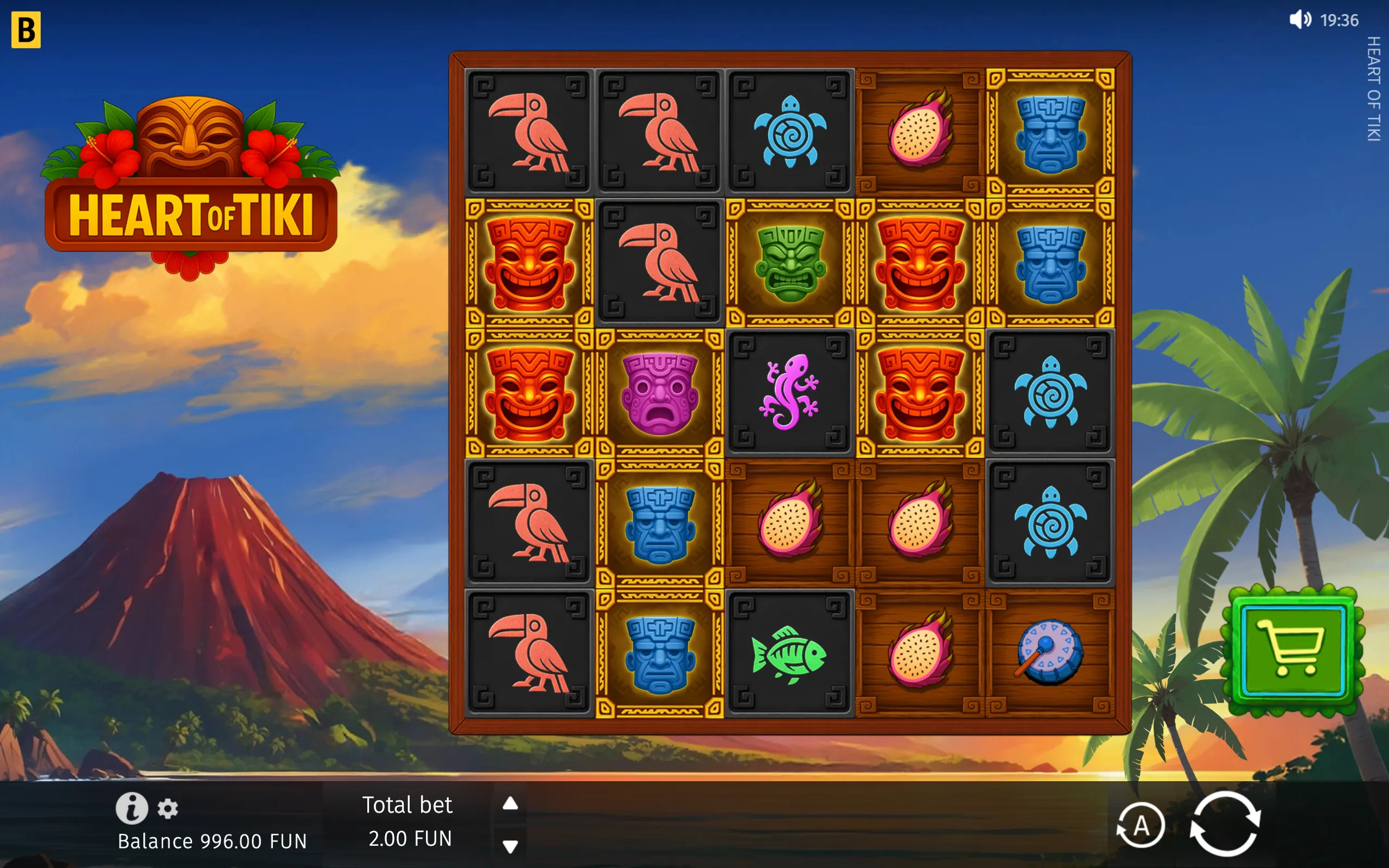 Heart of Tiki slot game with colorful tiki masks, toucans, turtles, tropical fruit, fish, and drums on a Polynesian island backdrop with a volcano and palm trees.