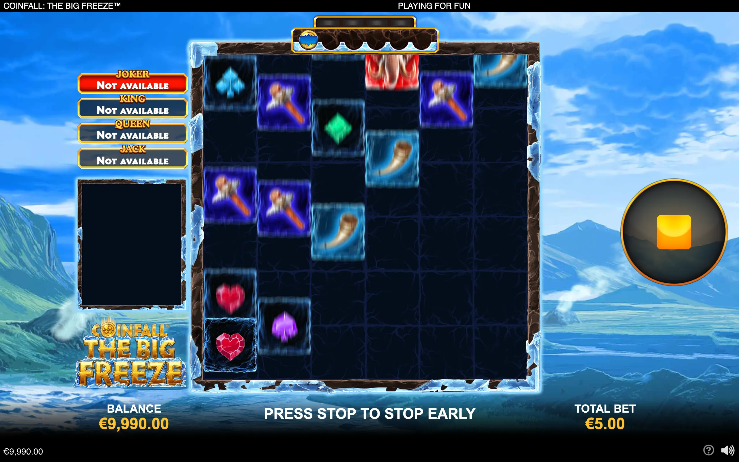 CoinFall: The Big Freeze slot interface with icy reels, colorful card-suit symbols, horn icons, jackpot labels, and a snowy mountain landscape.
