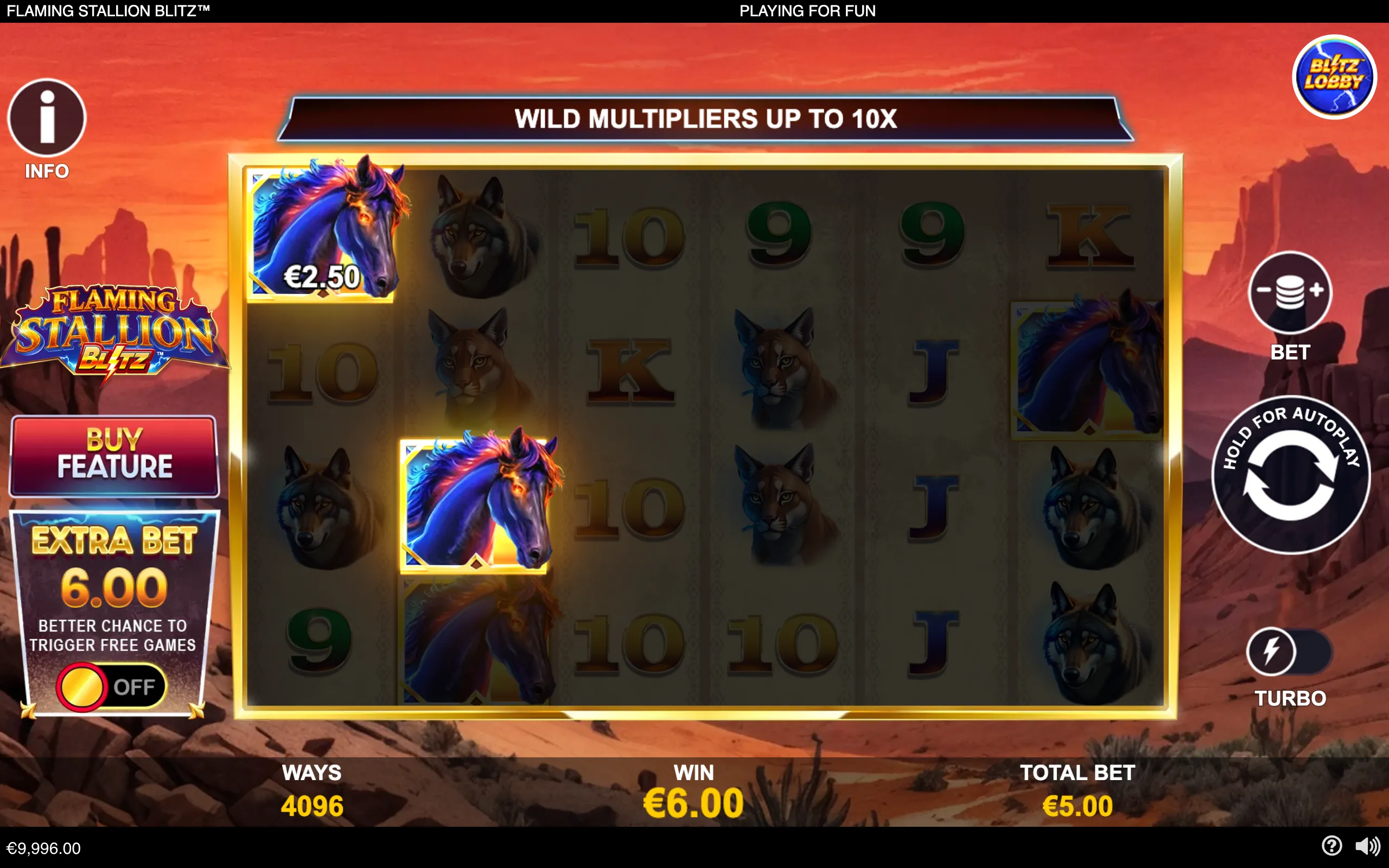 Flaming Stallion Blitz slot interface with glowing blue-and-orange stallion symbols, wolf and big-cat icons, card-value symbols, and a red desert canyon backdrop.