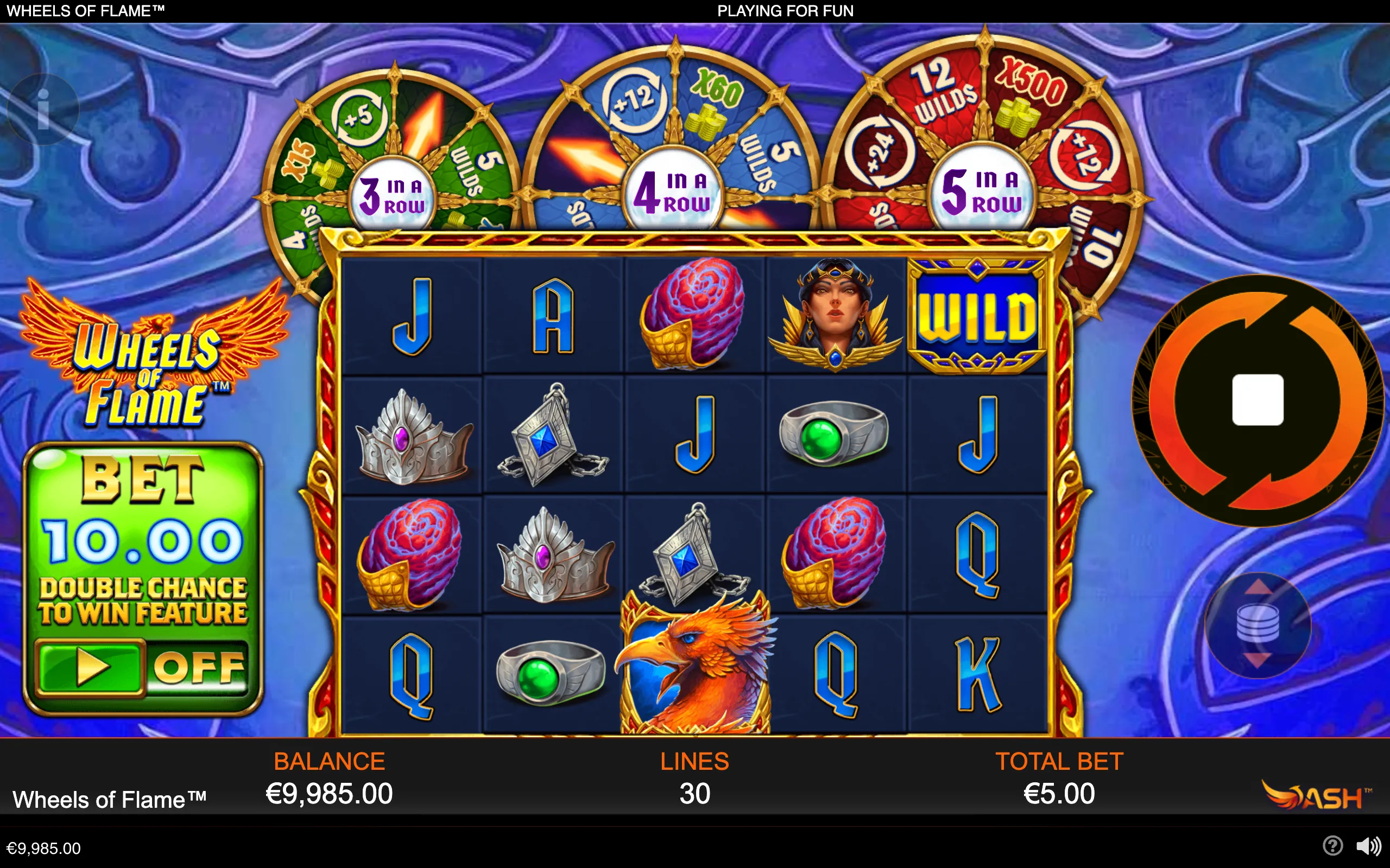 Wheels of Flame slot interface with a five-reel layout, phoenix and fantasy symbols, three fiery bonus wheels, wild and multiplier segments, and a blue-purple backdrop.