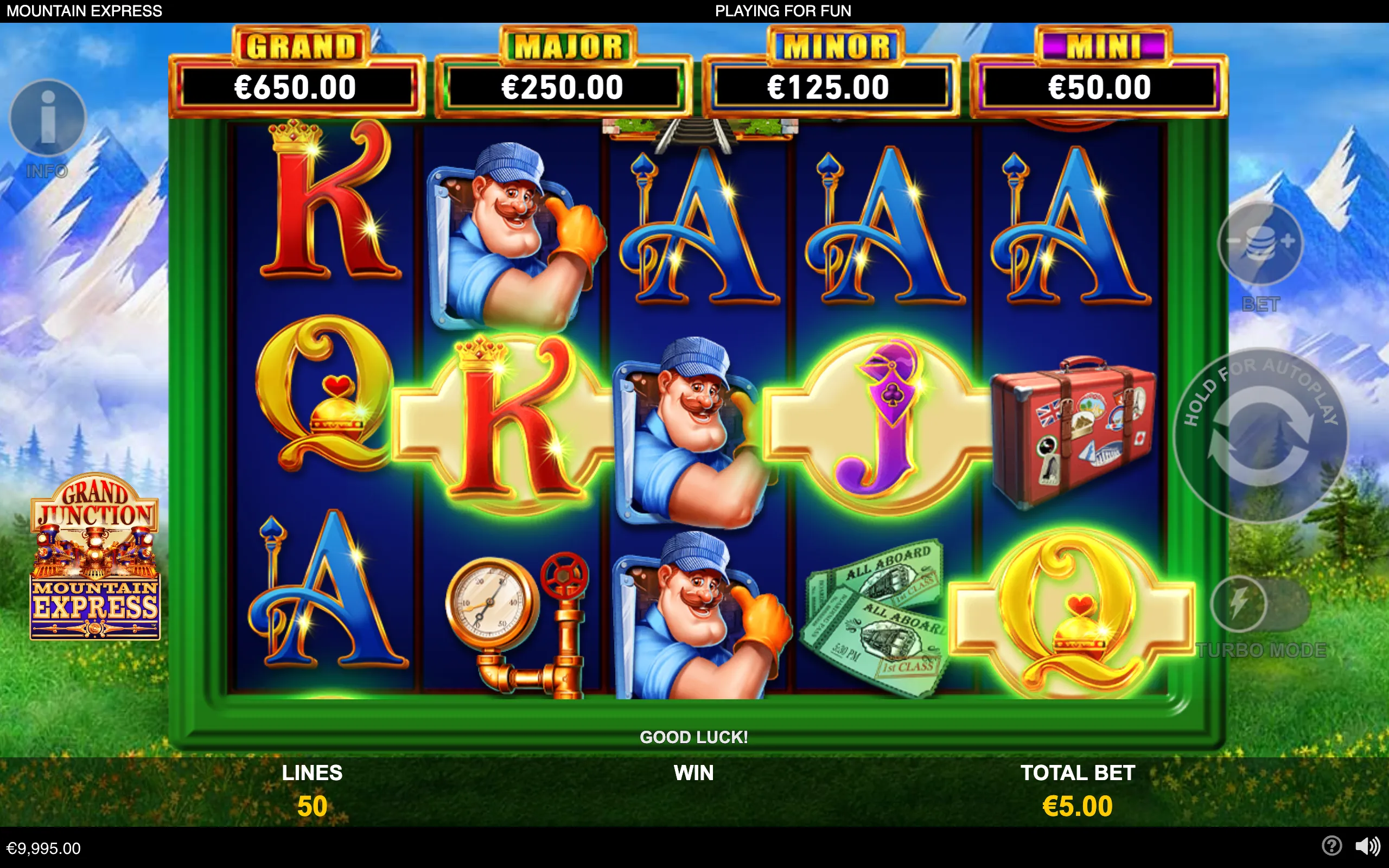 Grand Junction Mountain Express slot reels featuring a smiling railway worker, playing-card symbols, travel items, jackpot meters, and snowy mountain scenery.