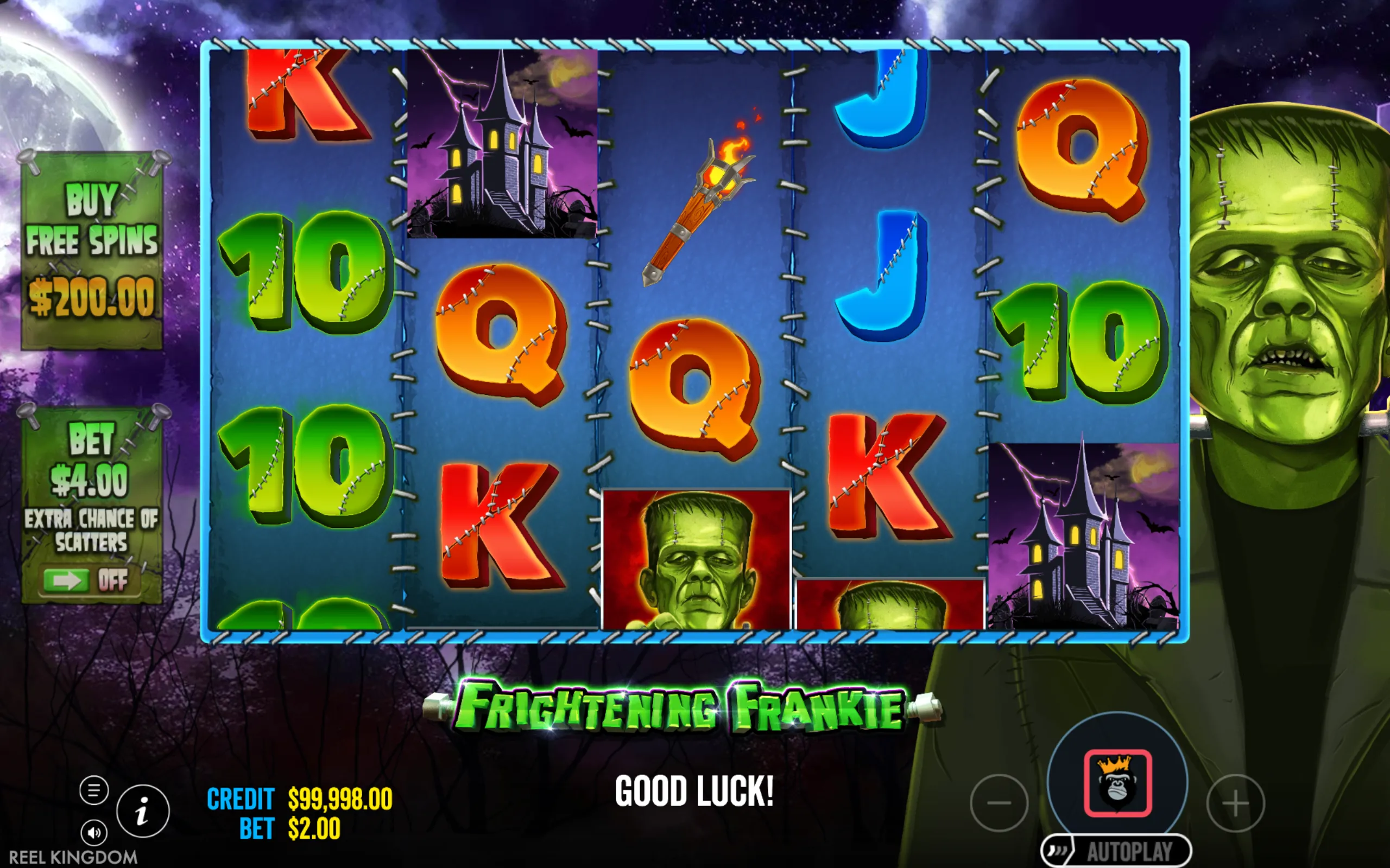 Frightening Frankie slot game with stitched letter symbols, haunted house, torch, and Frankenstein monster on a dark, moonlit night background