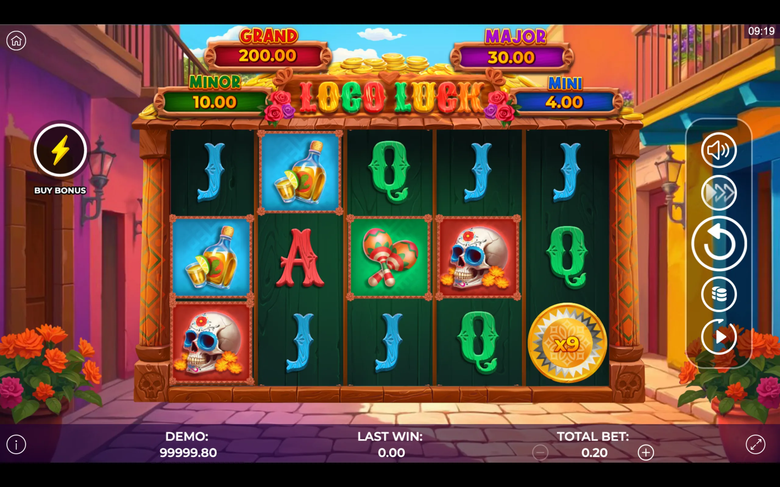 Loco Luck slot game with vibrant Day of the Dead-themed symbols including decorated skulls, maracas, tequila bottles, and colorful letters, set against a festive street backdrop with jackpot tiers displayed.