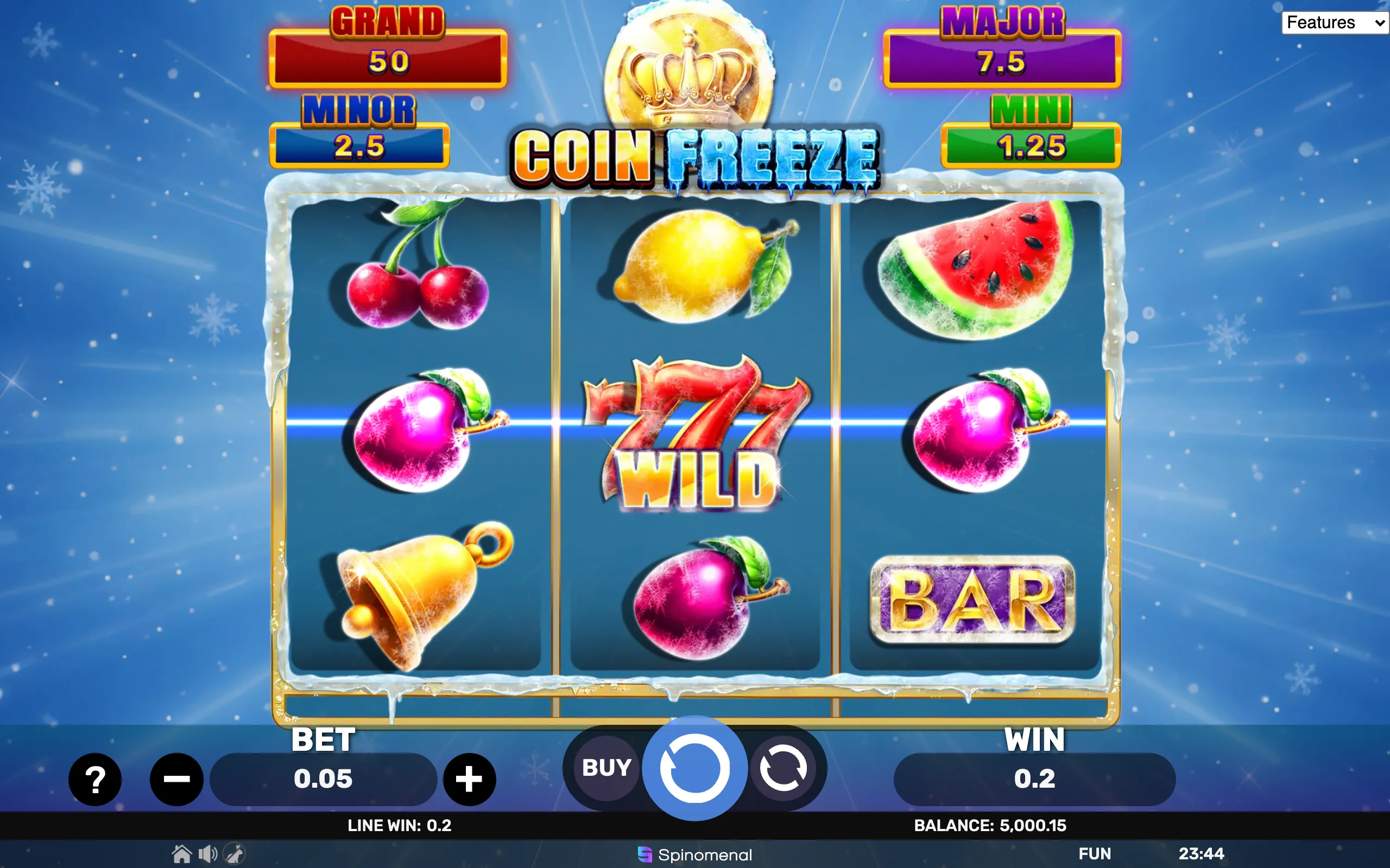 Coin Freeze slot game with icy fruit symbols, a wild 777, and jackpot tiers displayed above the reels.
