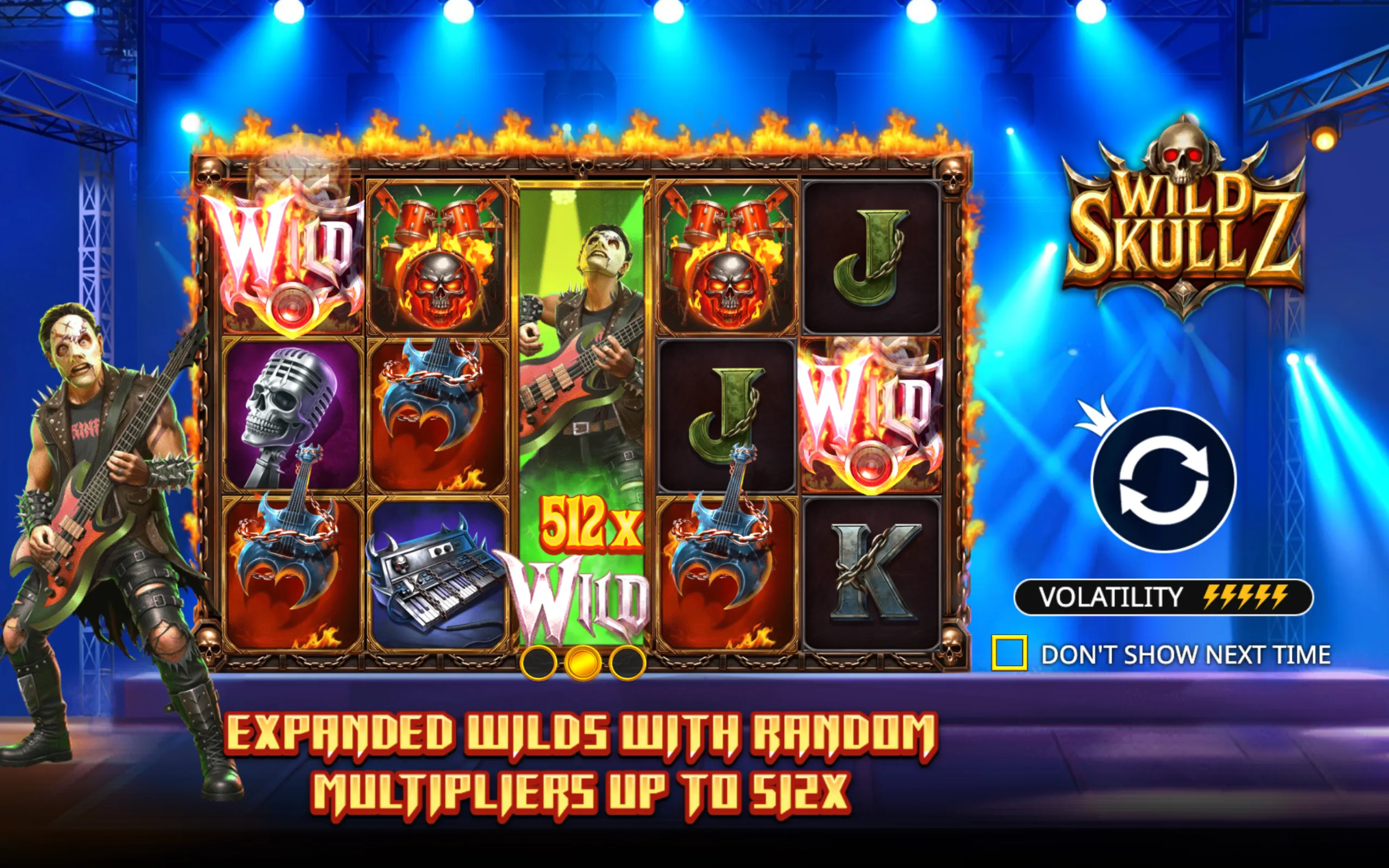 Wild Skullz slot game featuring flaming wild symbols, rock band characters, and musical instrument icons on a stage with blue spotlights.