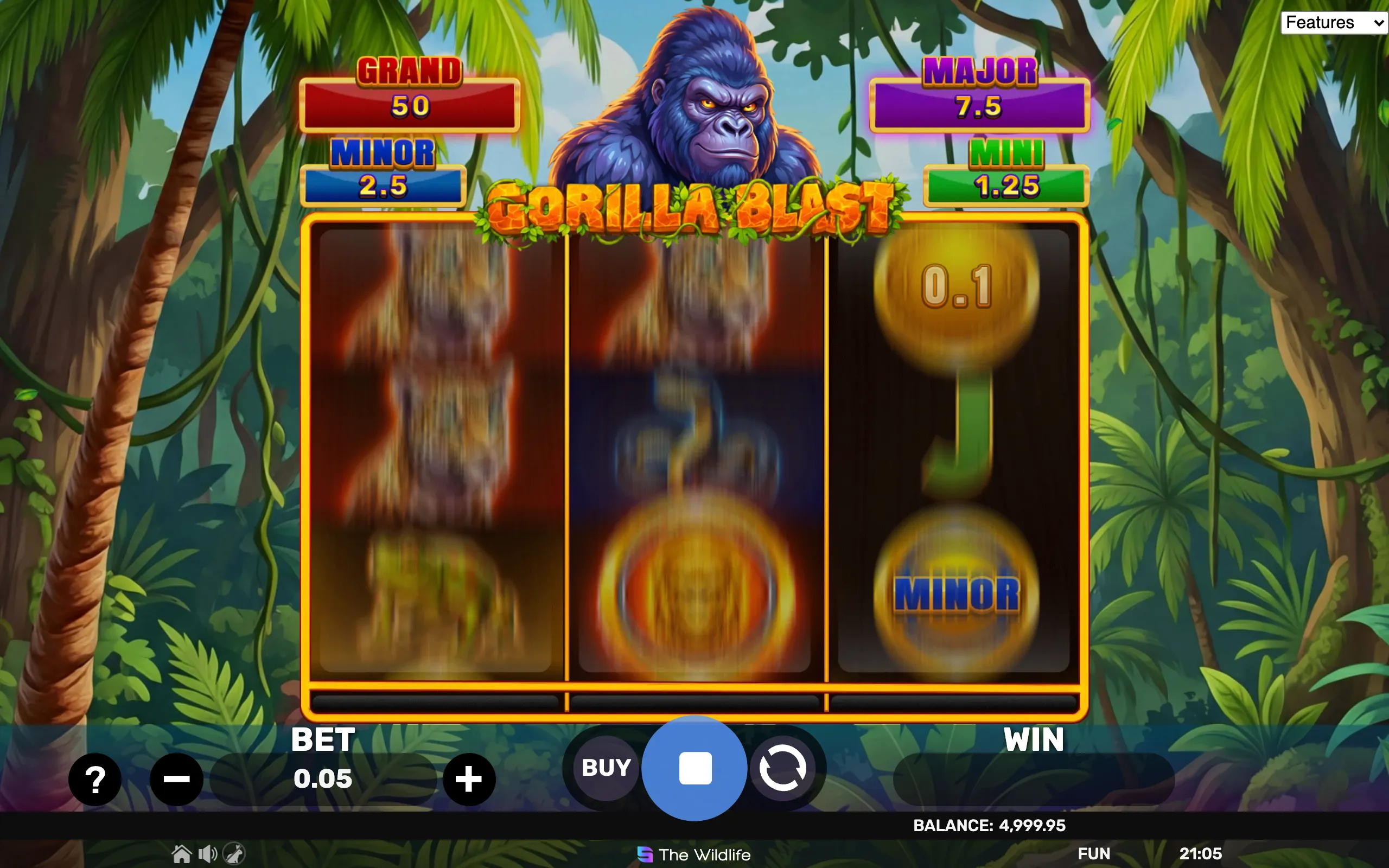 A jungle-themed slot game featuring a powerful gorilla mascot above a 3x3 reel layout with highlighted jackpot tiers labeled Grand, Major, Minor, and Mini.