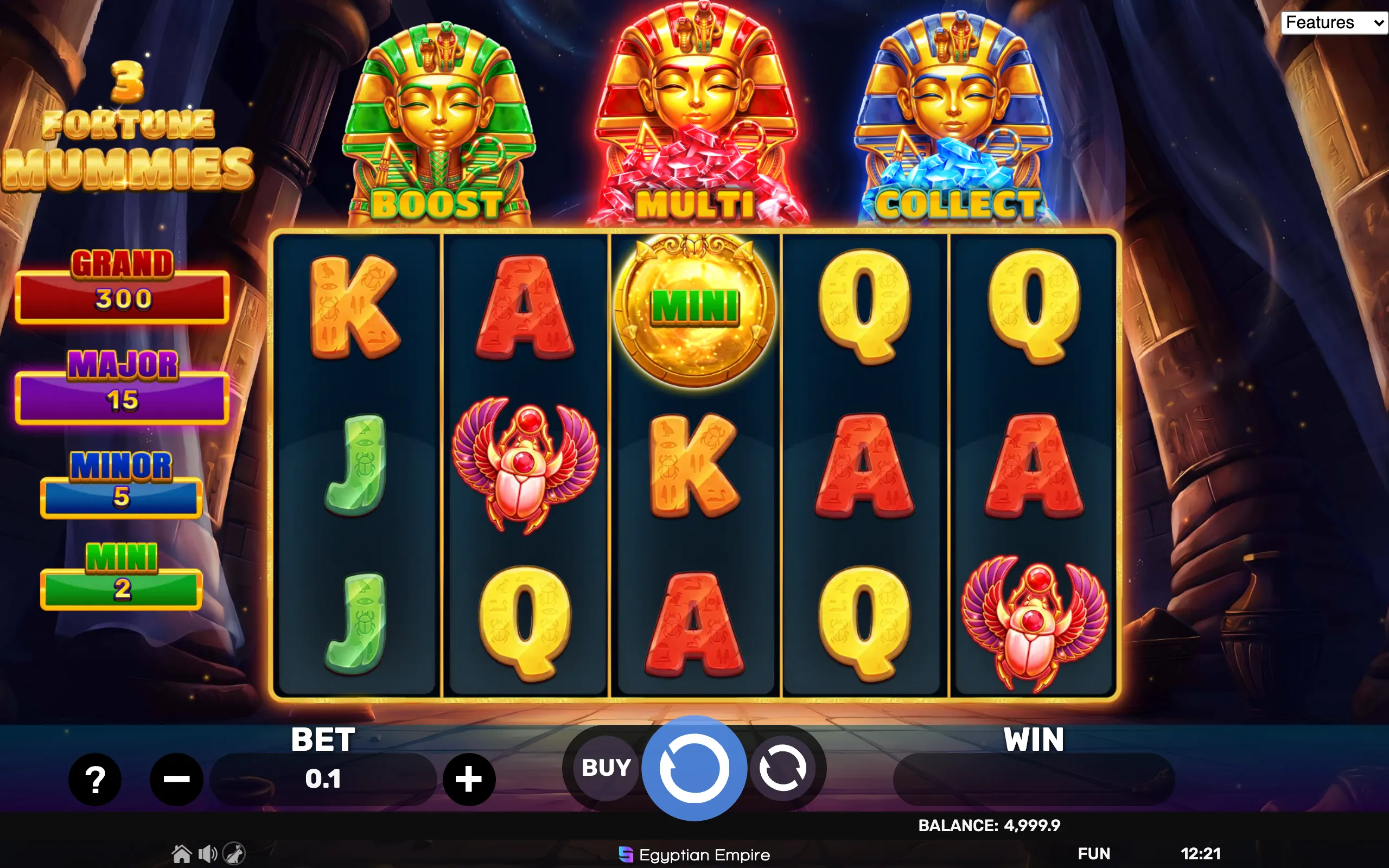 Egyptian-themed slot game interface featuring three golden mummy symbols labeled BOOST, MULTI, and COLLECT, alongside various hieroglyphic-style playing card symbols and jackpot tiers.