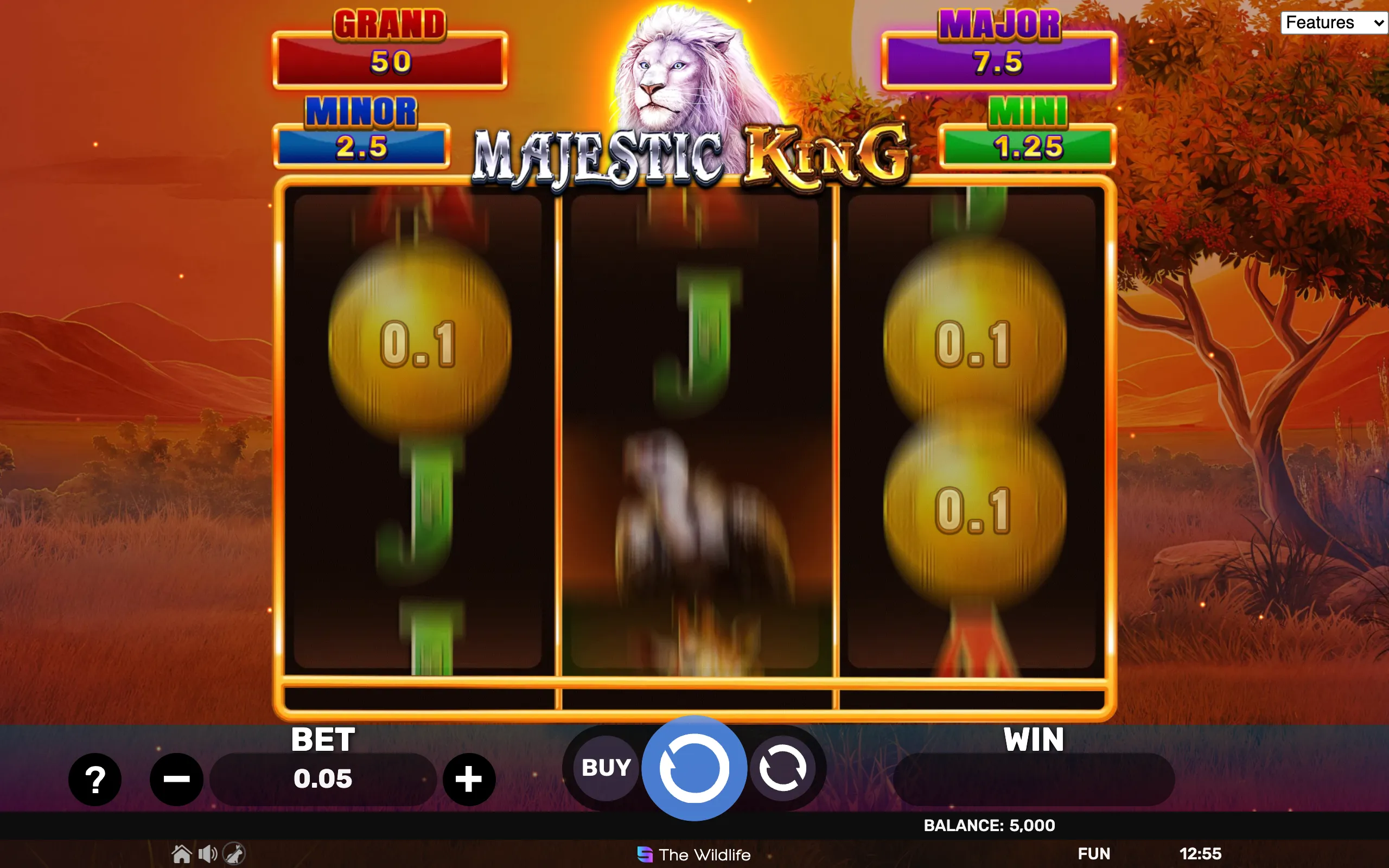 Majestic King slot game interface featuring a white lion logo, jackpot tiers labeled Grand, Major, Minor, and Mini, and a 3x3 reel set with nature-themed symbols.