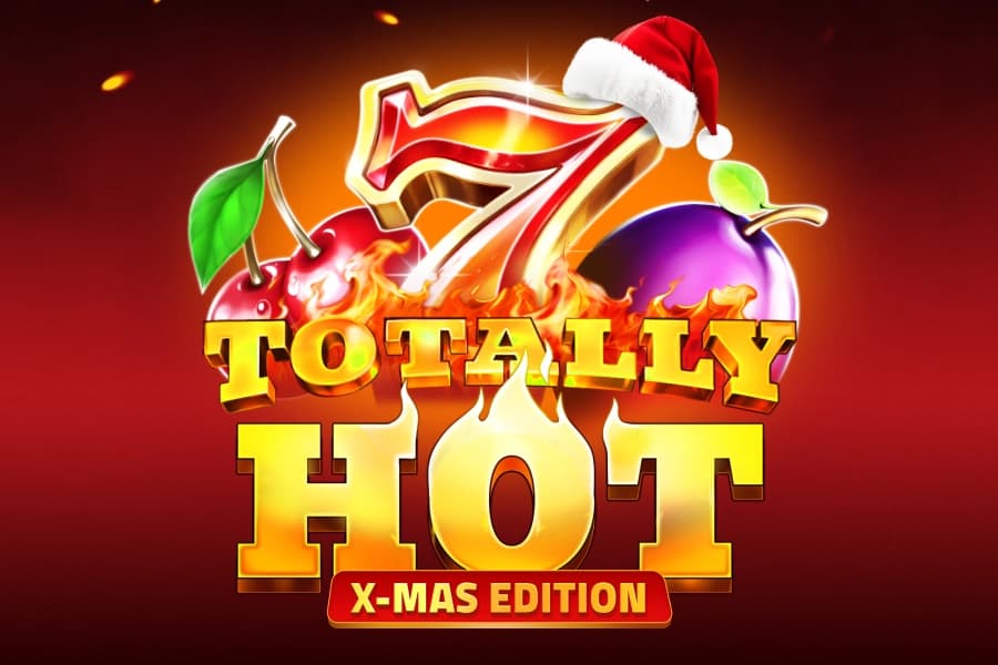 alt: Totally Hot X-Mas Edition slot logo with flaming seven, fruits, and Santa hat