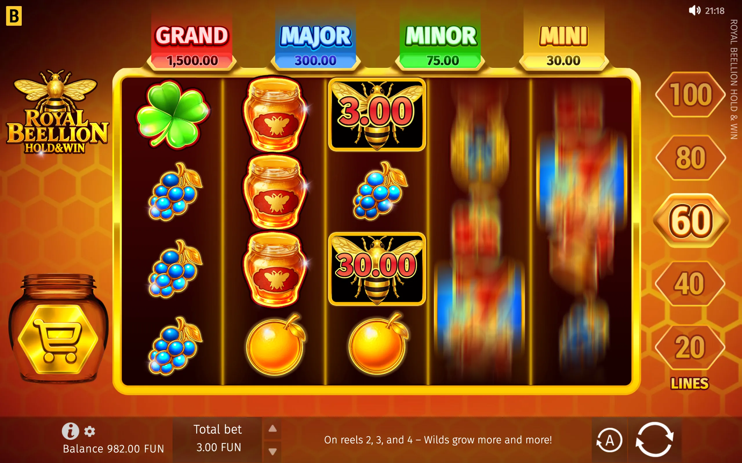 Royal Beellion slot reels feature honey jars, bees, blue berries, clovers and orange fruit beneath Grand, Major, Minor and Mini jackpot meters. A honeycomb backdrop and gold-trimmed interface reinforce the bee-and-honey theme.